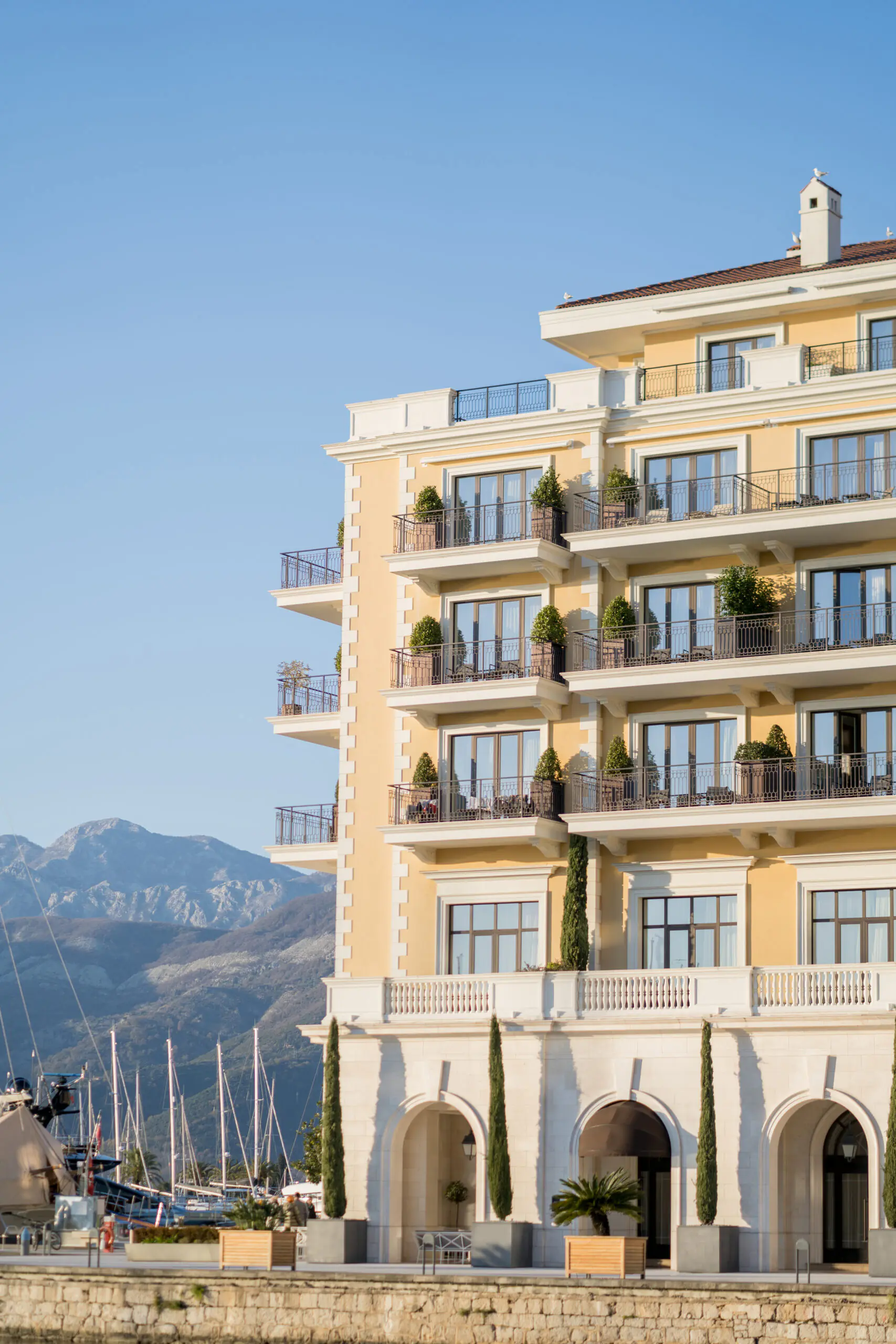 Luxury waterfront hotel with mountain views