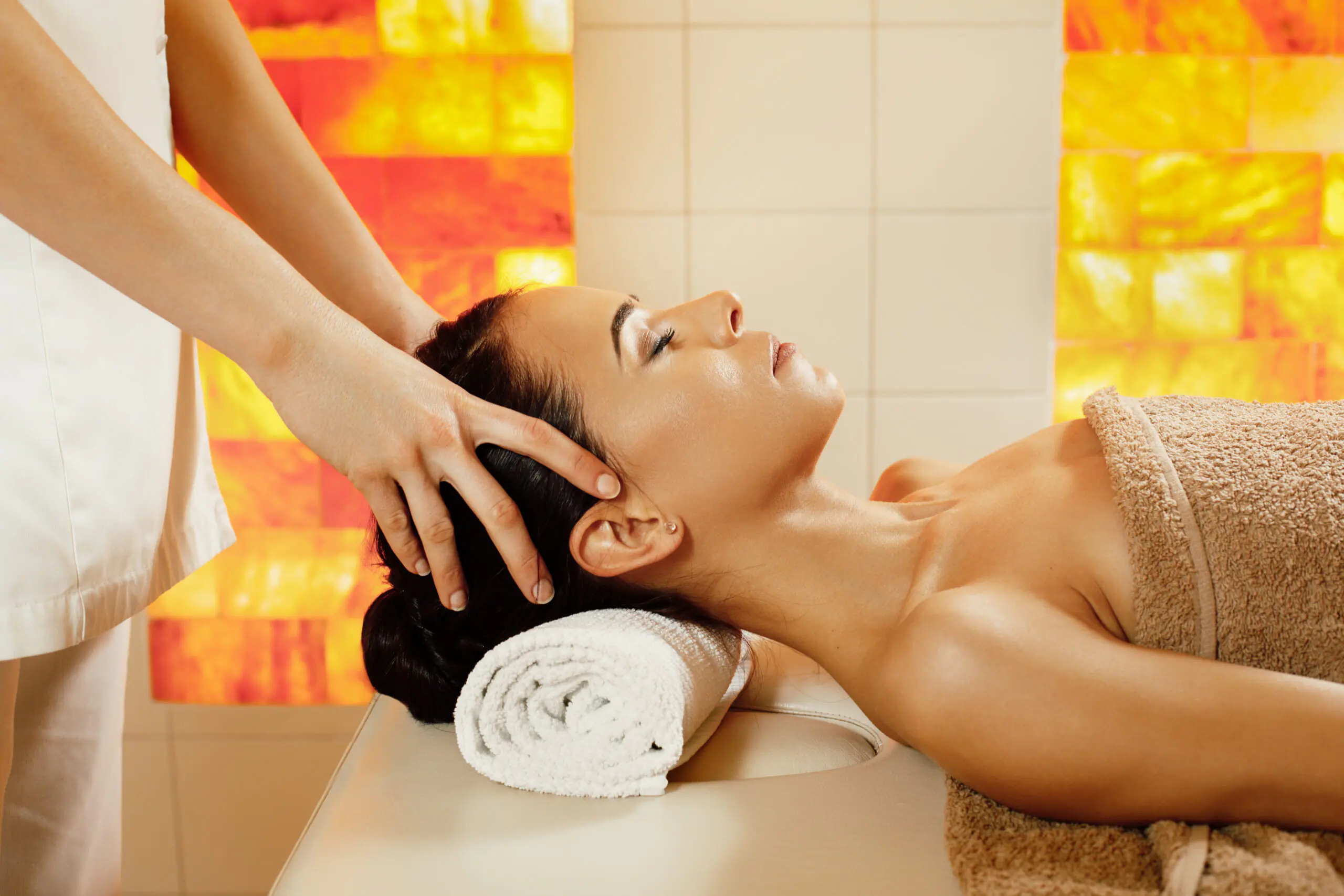 Woman having head massage in the spa salon